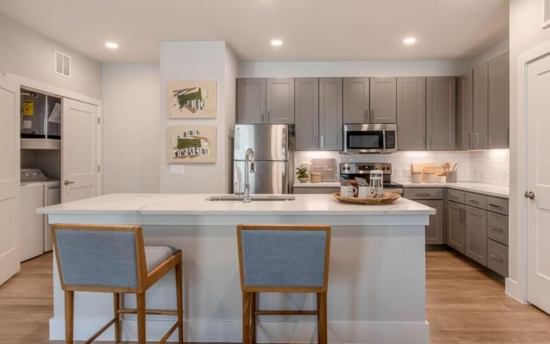 a kitchen with a table and chairs