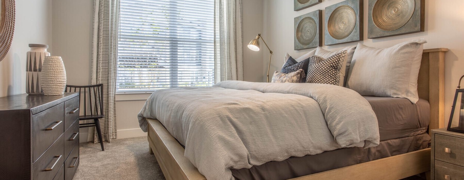 a bedroom with a bed and a dresser