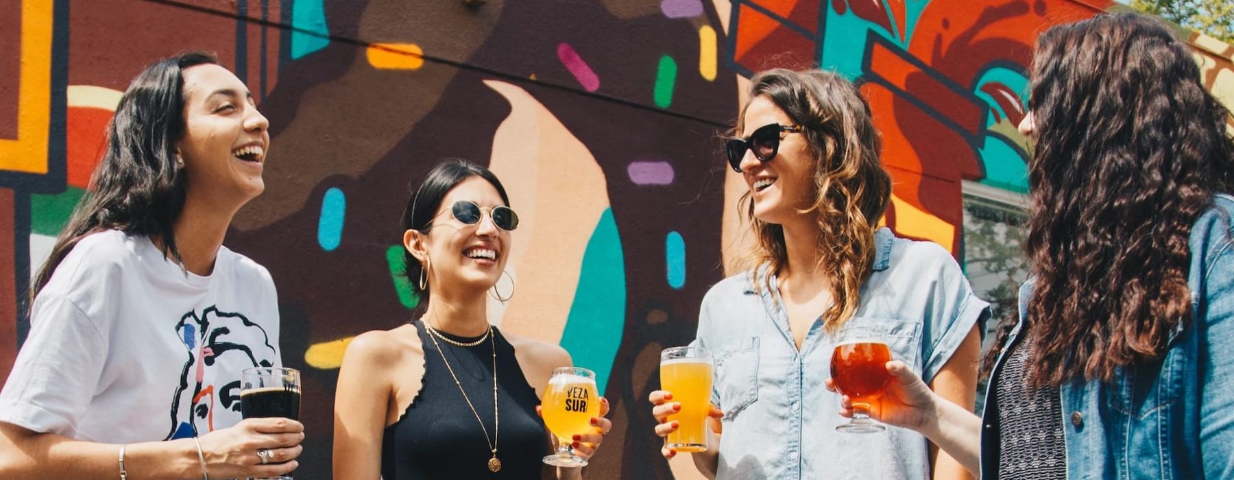a group of people holding drinks