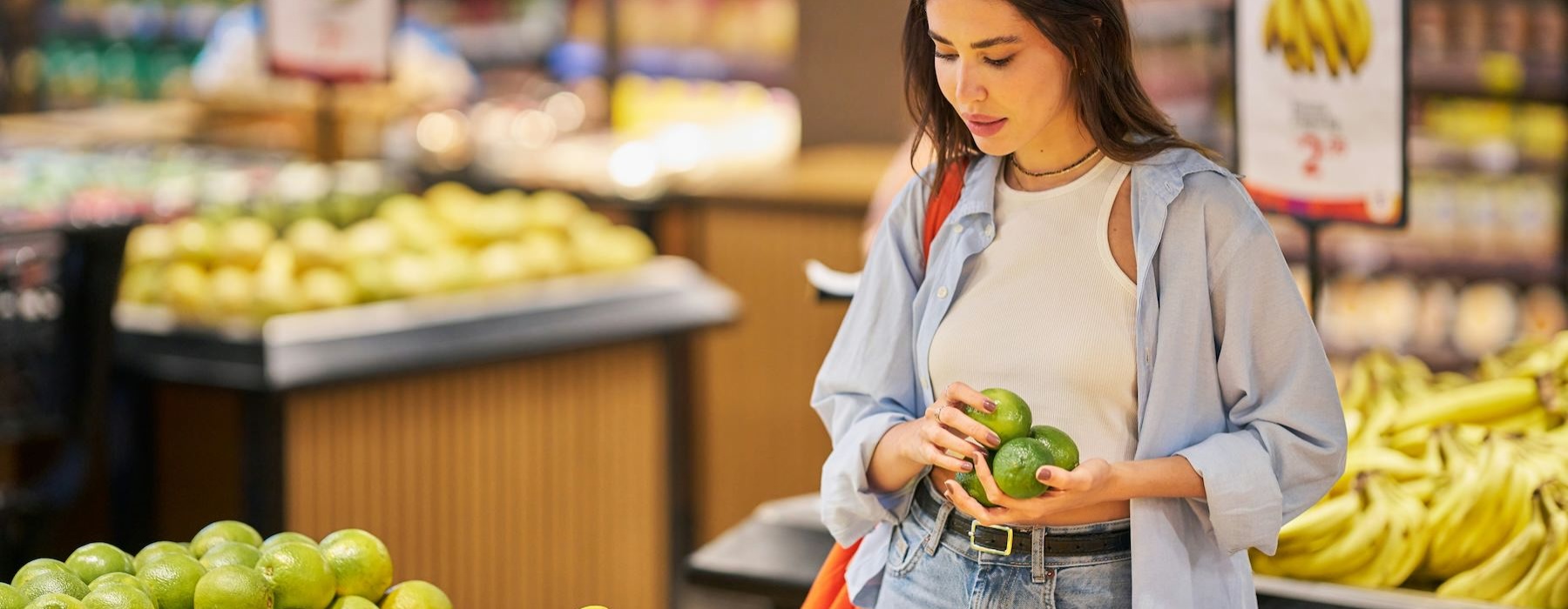 a woman holding a fruit